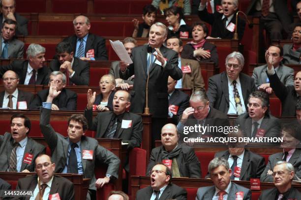 Head of the French socialist party group at the National assembly Jean-Marc Ayrault addresses French Prime Minister Francois Fillon on December 17,...