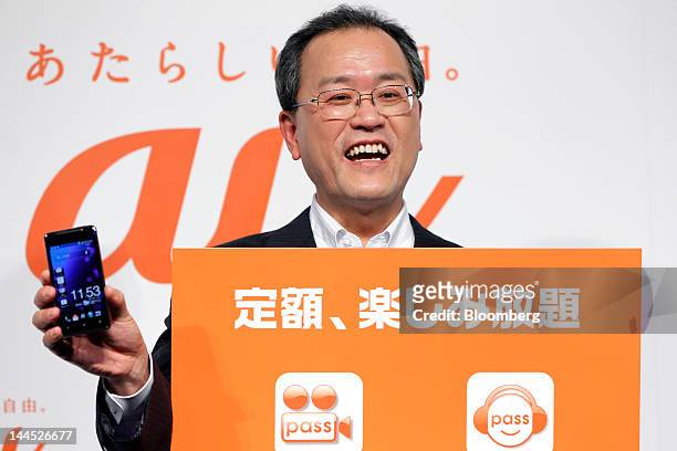 Takashi Tanaka, president of KDDI Corp., poses during a photo session at the unveiling of the company's new products and services in Tokyo, Japan, on...