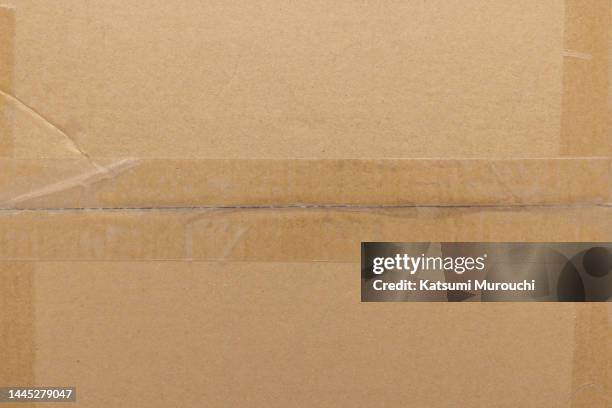 taped corrugated cardboard texture background - cartón fotografías e imágenes de stock