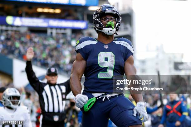 Kenneth Walker III of the Seattle Seahawks celebrates his touchdown against the Las Vegas Raiders during the first quarter at Lumen Field on November...