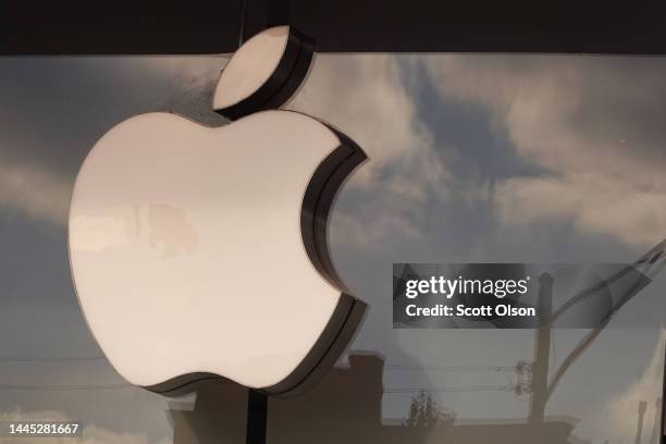 The Apple company logo hangs above an Apple retail store on November 28, 2022 in Chicago, Illinois. Apple is currently facing shortages in iPhone...