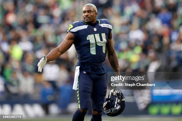Metcalf of the Seattle Seahawks looks on during the fourth quarter against the Las Vegas Raiders at Lumen Field on November 27, 2022 in Seattle,...
