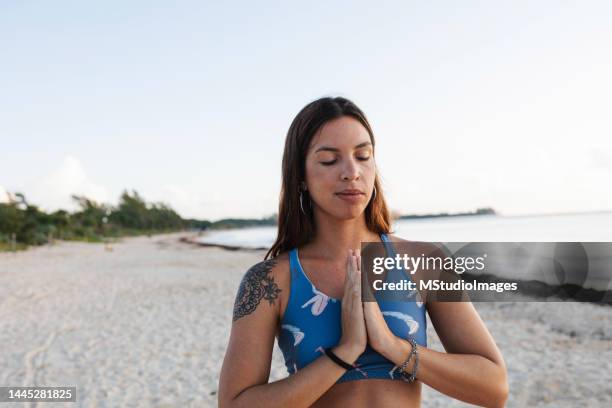 meditation - latina woman yoga stock pictures, royalty-free photos & images