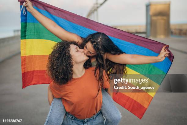 proud couple kissing - images of lesbians kissing stock pictures, royalty-free photos & images