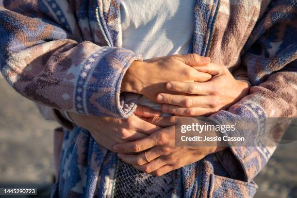 close up of two women's hands embracing - lgbtq  and female domestic life fotografías e imágenes de stock