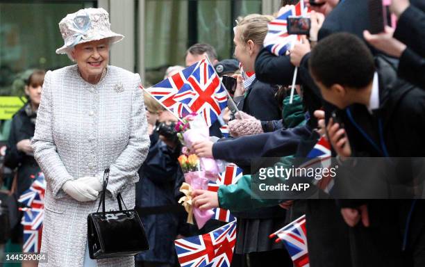 Britain's Queen Elizabeth II is pictured after her visit to Glades Shopping Centre in Bromley, south London, on May 15, 2012. The Queen's Diamond...