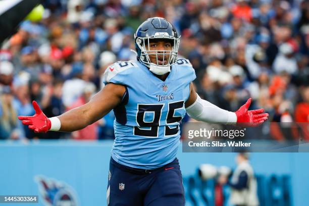 DeMarcus Walker of the Tennessee Titans walks off the field after a play against the Cincinnati Bengals at Nissan Stadium on November 27, 2022 in...