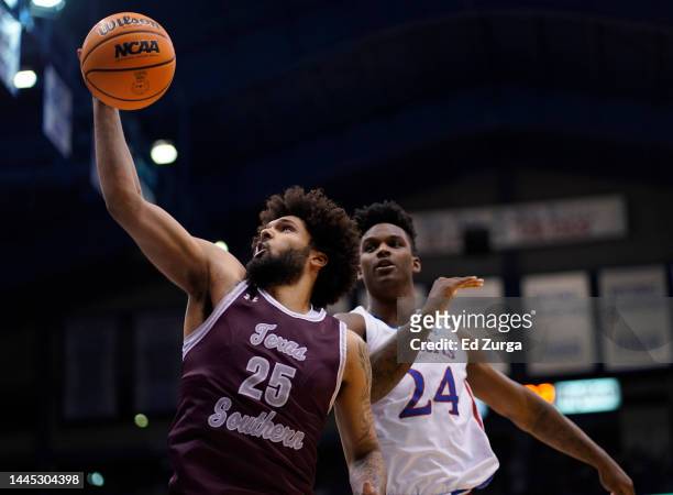 Grayson Carter of the Texas Southern Tigers rebounds the ball against K.J. Adams Jr. #24 of the Kansas Jayhawks in the first half at Allen Fieldhouse...