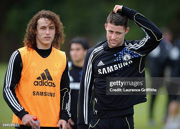 David Luiz and Gary Cahill of Chelsea walk off the field after training at Chelsea Training Ground on May 15, 2012 in Cobham, England.