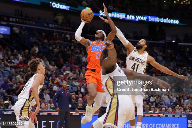 Shai Gilgeous-Alexander of the Oklahoma City Thunder shoots as Garrett Temple of the New Orleans Pelicans defends during the first half at Smoothie...