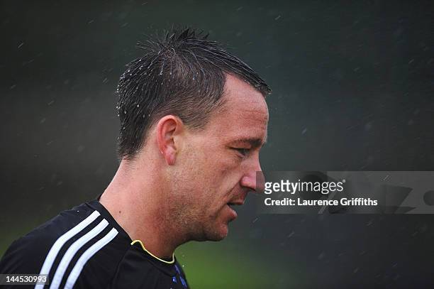 John Terry of Chelsea in action in the rain during training at Chelsea Training Ground on May 15, 2012 in Cobham, England.