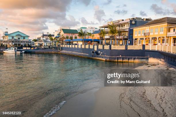 george town waterfront at sunset, grand cayman, cayman islands - grand cayman stock pictures, royalty-free photos & images