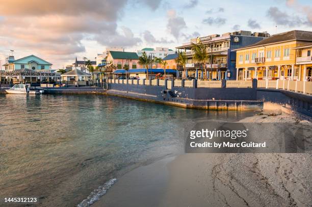george town waterfront at sunset, grand cayman, cayman islands - georgetown imagens e fotografias de stock