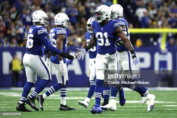 Yannick Ngakoue of the Indianapolis Colts celebrates sacking Kenny Pickett of the Pittsburgh Steelers during the first quarter in the game at Lucas...