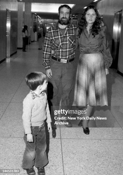 Actress Linda Lovelace aka Linda Susan Boreman with her husband Larry Marchiano at Mineola Supreme Court. Young boy is unidentified.