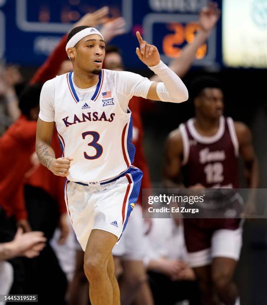 Dajuan Harris Jr. #3 of the Kansas Jayhawks celebrates a basket against the Texas Southern Tigers in the second half at Allen Fieldhouse on November...