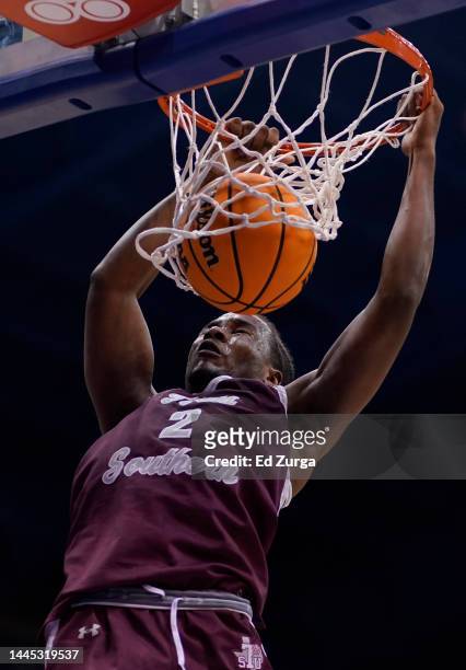 Davon Barnes of the Texas Southern Tigers dunks against the Kansas Jayhawks in the second half at Allen Fieldhouse on November 28, 2022 in Lawrence,...