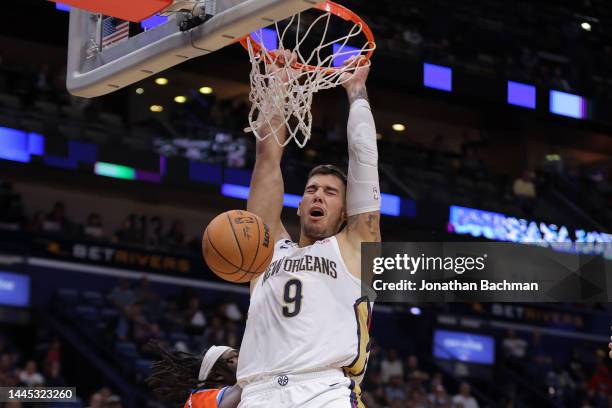 Willy Hernangomez of the New Orleans Pelicans dunks during the second half against the Oklahoma City Thunder at Smoothie King Center on November 28,...