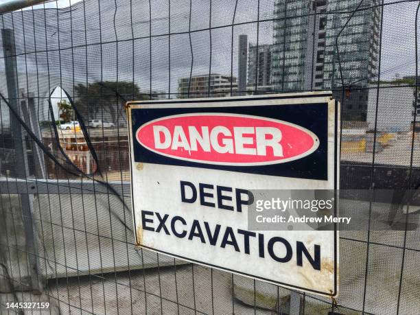 danger deep excavation sign on fence construction site - wire mesh construction stock pictures, royalty-free photos & images