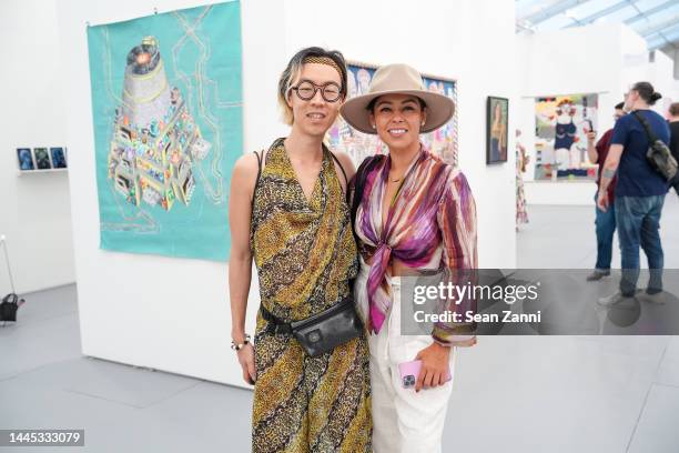 Young Sun Han and Krystal Cano attend the Untitled Art Fair VIP Press Preview on November 28, 2022 in Miami Beach, Florida.