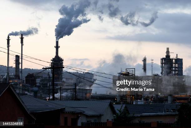 The Phillips 66 Los Angeles Refinery Wilmington Plant stands beyond a residential street on November 28, 2022 in Wilmington, California. Climate...