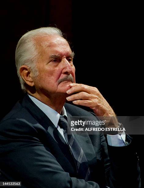 Mexican writer Carlos Fuentes takes part in a tribute to Mexican writer and anthropologist Fernando Benitez at the Fine Arts Palace in Mexico City,...