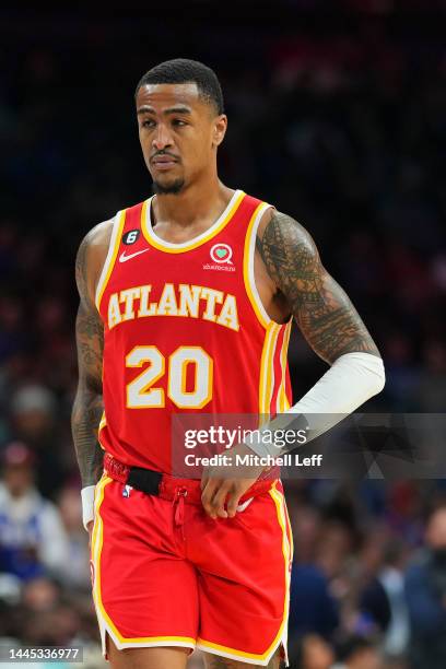 John Collins of the Atlanta Hawks looks on against the Philadelphia 76ers at the Wells Fargo Center on November 28, 2022 in Philadelphia,...