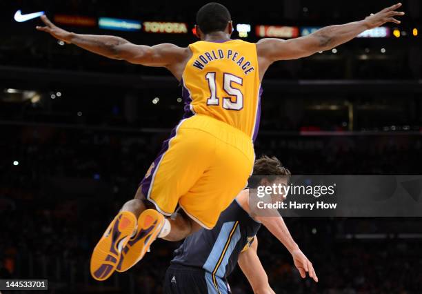 Metta World Peace of the Los Angeles Lakers leaps in the air as he guards Danilo Gallinari of the Denver Nuggets in Game Seven of the Western...