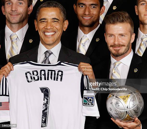 President Barack Obama poses for photographs with the Major League Soccer champions Los Angeles Galaxy and their mid-fielder David Beckham in the...