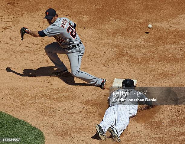 Ryan Raburn of the Detroit Tigers can't handle the throw as Alejandro De Aza of the Chicago White Sox steals second base at U.S. Cellular Field on...