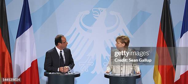 German Chancellor Angela Merkel and French President Francois Hollande speak to the media following talks at the Chancellery hours after Hollande's...