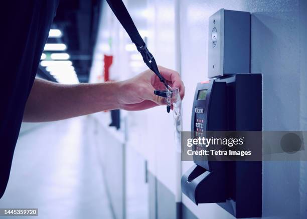 close-up of employee using keycard and digital door lock in office - swipe right stock pictures, royalty-free photos & images