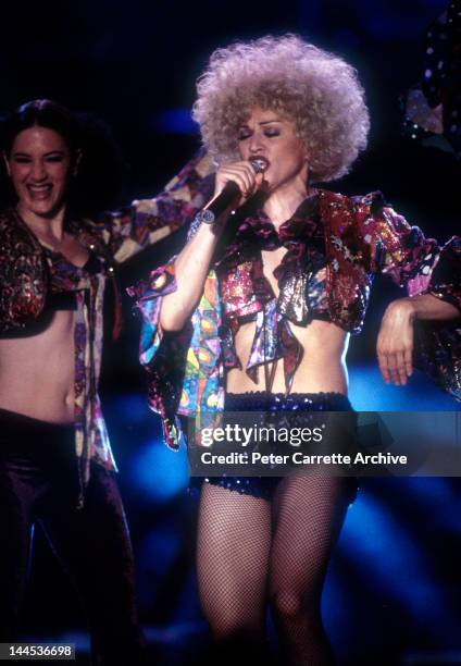 American singer songwriter Madonna performs live on stage during her 'Girlie Show - Live Down Under' world concert tour at the Sydney Cricket Ground...