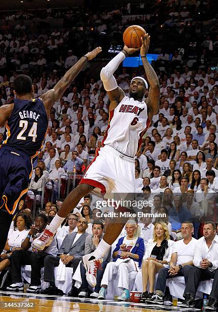 LeBron James of the Miami Heat shoots over Paul George of the Indiana Pacers during Game Two of the Eastern Conference Semifinals in the 2012 NBA...