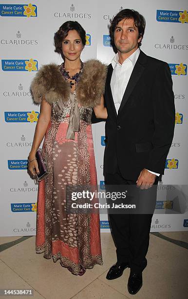 Astrid Munoz and Eduardo Novillo Astrada poses at the Marie Curie Cancer Care Fundraiser, hosted by Heather Kerzner at Claridge's Hotel on May 15,...