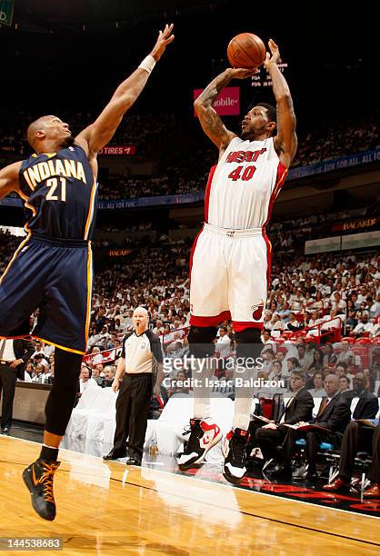 Udonis Haslem of the Miami Heat takes a jump shot over David West of the Indiana Pacers in Game Two of the Eastern Conference Semifinals during the...