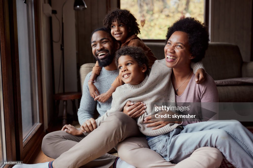 Happy black family enjoying in their time at home.