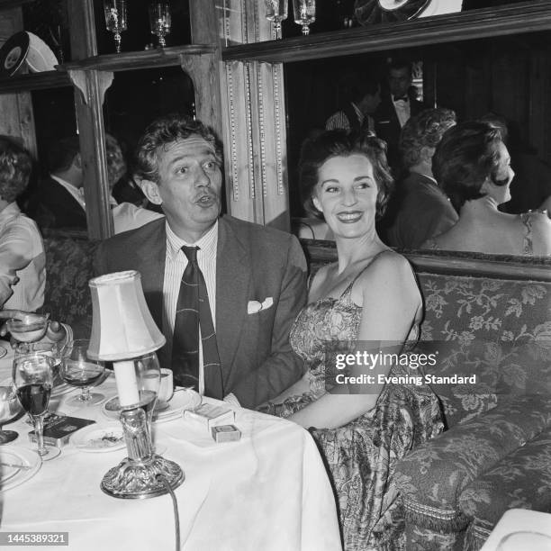 British-Australian actor Peter Finch and his wife, the British actress Yolande Turner , during a night out on August 10th, 1960.