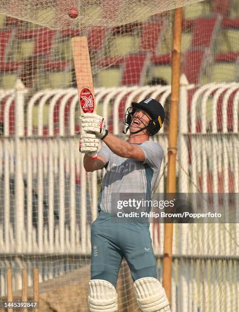 Keaton Jennings of England hits a ball on top of the nets during a training session before the first Test against Pakistan at Rawalpindi Cricket...