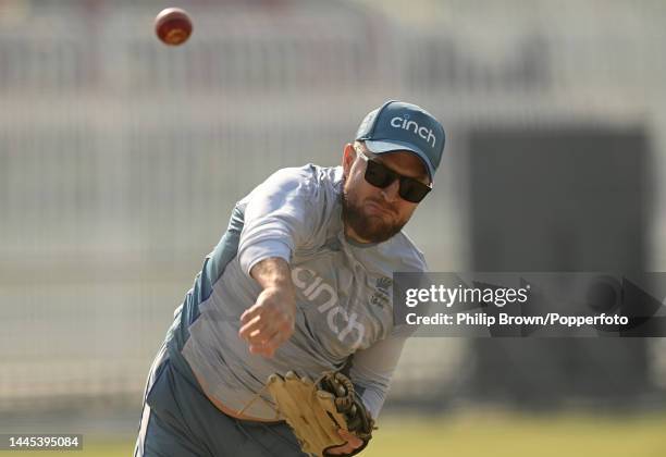 Brendon McCullum of England throws a ball during a training session before the first Test against Pakistan at Rawalpindi Cricket Stadium on November...