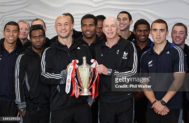 New Zealand Sevens captain DJ Forbes and coach Gordon Tietjens hold the Sevens World Series Trophy upon their arrival home at Auckland International...
