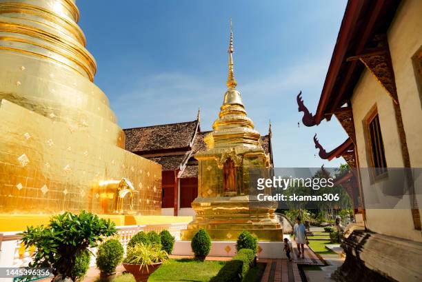 beautiful golden pagoda  at wat phra singh woramahawihan  temple  southeast asia architecture style  at chiangmai province thailand - buddhist flag stock pictures, royalty-free photos & images