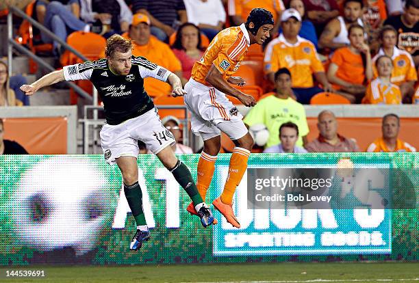 Steven Smith of the Portland Timbers and Calen Carr of the Houston Dynamo at BBVA Compass Stadium on May 15, 2012 in Houston, Texas.