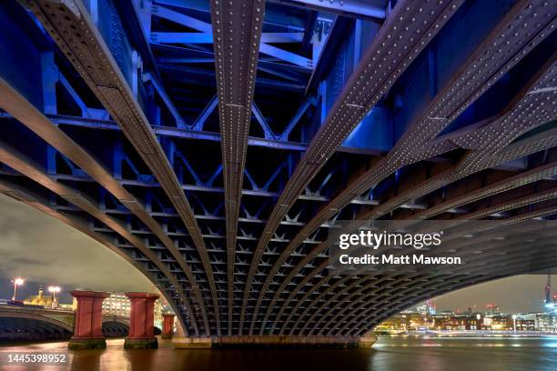 underneath cannon street railway bridge and the thames river night london uk. - low section stock pictures, royalty-free photos & images