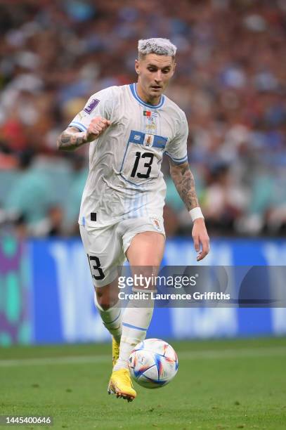 Guillermo Varela of Uruguay runs with the ball during the FIFA World Cup Qatar 2022 Group H match between Portugal and Uruguay at Lusail Stadium on...
