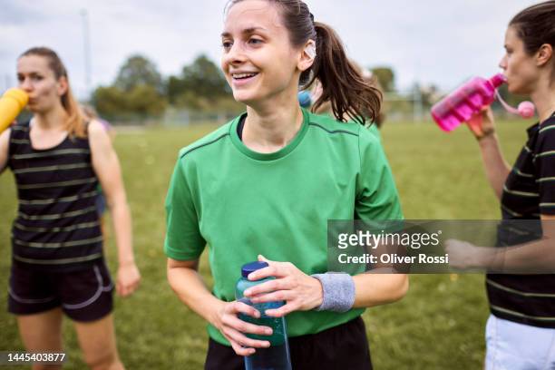 smiling female rugby player on sports field - rugby union 個照片及圖片檔