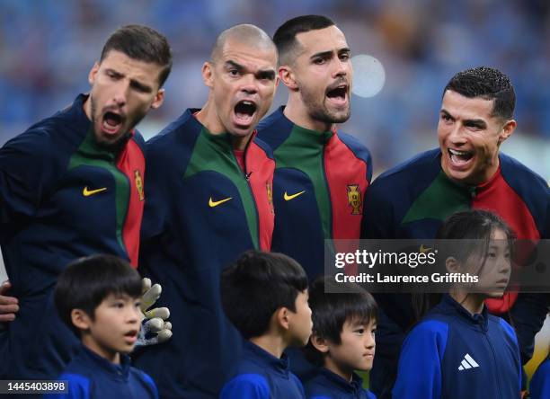 L-r Ruben Dias, Pepe, Diogo Costa and Cristiano Ronaldo of Portugal line up for the national anthems during the FIFA World Cup Qatar 2022 Group H...