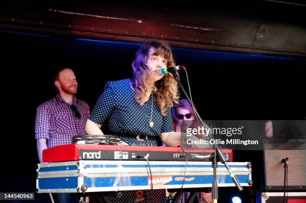 Ryan Drabble, Jeanette Stewart and Paul Ross of Slow Down, Molasses perform on stage at the Dr Martins street gig airstream trailor during The Great...