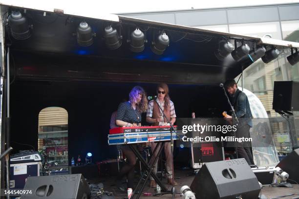 Jeanette Stewart, Paul Ross and Tyson McShane of Slow Down, Molasses perform on stage at the Dr Martins street gig airstream trailor during The Great...