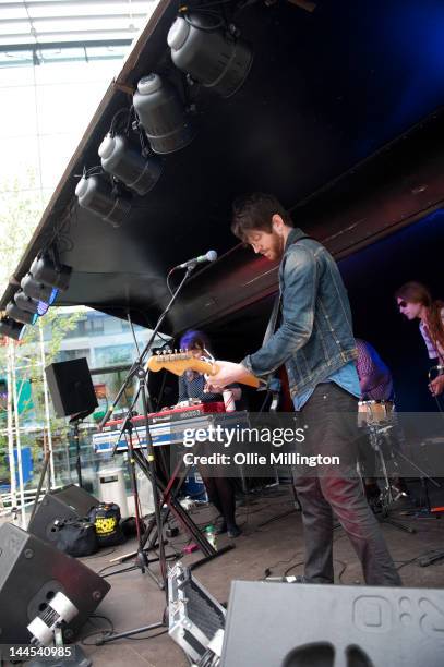 Jeanette Stewart, Tyson McShane and Paul Ross of Slow Down, Molasses perform on stage at the Dr Martins street gig airstream trailor during The Great...